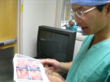 Dr. Shen reviews images from the surgery