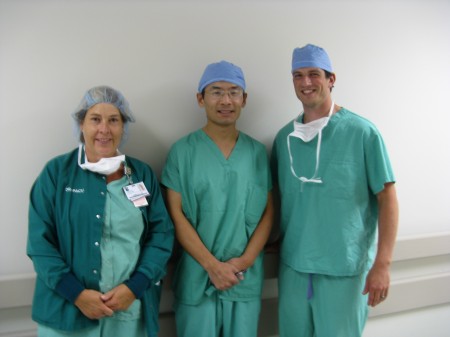 Minutes after the ground-breaking surgery, the surgery team marks the occasion. From left to right: Pam Dutcher, RN, Dr. Jain Shen, Jacob Dutcher, CRNA.