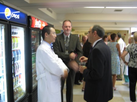 Dr. Shen speaks to Fulton County President, Wally Hart at a Littauer reception