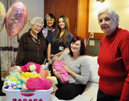 NLH & NH Auxiliary welcome Littauer’s Birthing Center’s first baby of the year with a gift basket. Auxilian Anita Beck, First Baby Gift Basket Chariman, left, Director of Volunteer Services Susan McNeil, New Visions student Alyssa Cinelli-Carbone, new mom Megan Miller holding first baby Emma Noel, and Auxiliary President  Norma Cozzolino.