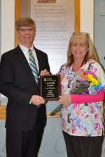 NLH President and CEO Laurence E. Kelly presents medical receptionist Barbara Hill with the NLH 2015 fourth-quarter Goodwill Award