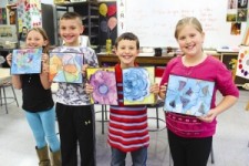 Photo submitted Boulevard Elementary students, from left, Kendra Mitchell, Caelan Porter, Mahmoud Sbahi and Payton Dow were among the third-graders who created watercolor paintings that will be displayed at the Nathan Littauer Nursing Home. 