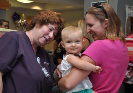 Littauer’s Lactation Consultant Nancy Quinlan, RN, IBCLC, left, greets one of the many mothers and young babies she has consulted with about breast feeding
