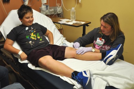 Littauer Emergency Care Center patient Zachary Robinson is treated by Danielle McDuffee, LPN