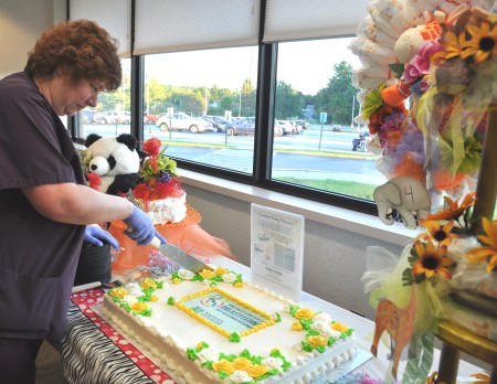 Littauer Lactation Consultant Nancy Quinlan, RN, IBCLC serving cake at last year’s World Breastfeeding Week Celebration at NLH