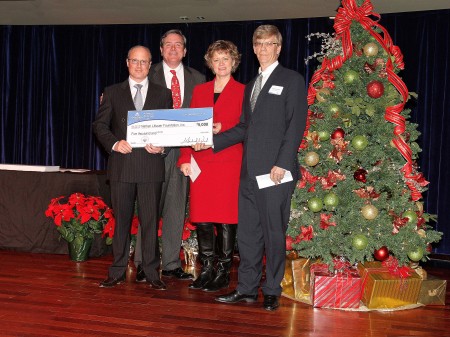 Littauer Foundation Executive Director Geoffrey Peck, left, and Littauer President and CEO Laurence E. Kelly, right, accept Saratoga Casino and Raceway’s 10th Annual Make a Difference event a check from Saratoga Casino and Raceway General Manager Mike Vild, and Sr. VP Marketing Rita Cox at the Saratoga Casino and Raceway’s 10th Annual Make a Difference event held in December.