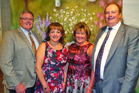 Dusten Rader/Express staff Guests stand in front of artwork by Broadalbin native Deb MacFarland Friday during Nathan Littuaer Hospital’s fundraiser, The Event. From left, Dr. Mark Caffrey, and his wife, Christine, of Gloversville; and Dottie MacVean and state Assemblyman Marc Butler.