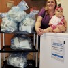 Littauer Radiologic Technologist, Amanda Fosman with infant daughter Aria, donates excess breastmilk to Littauer's Milk Depot